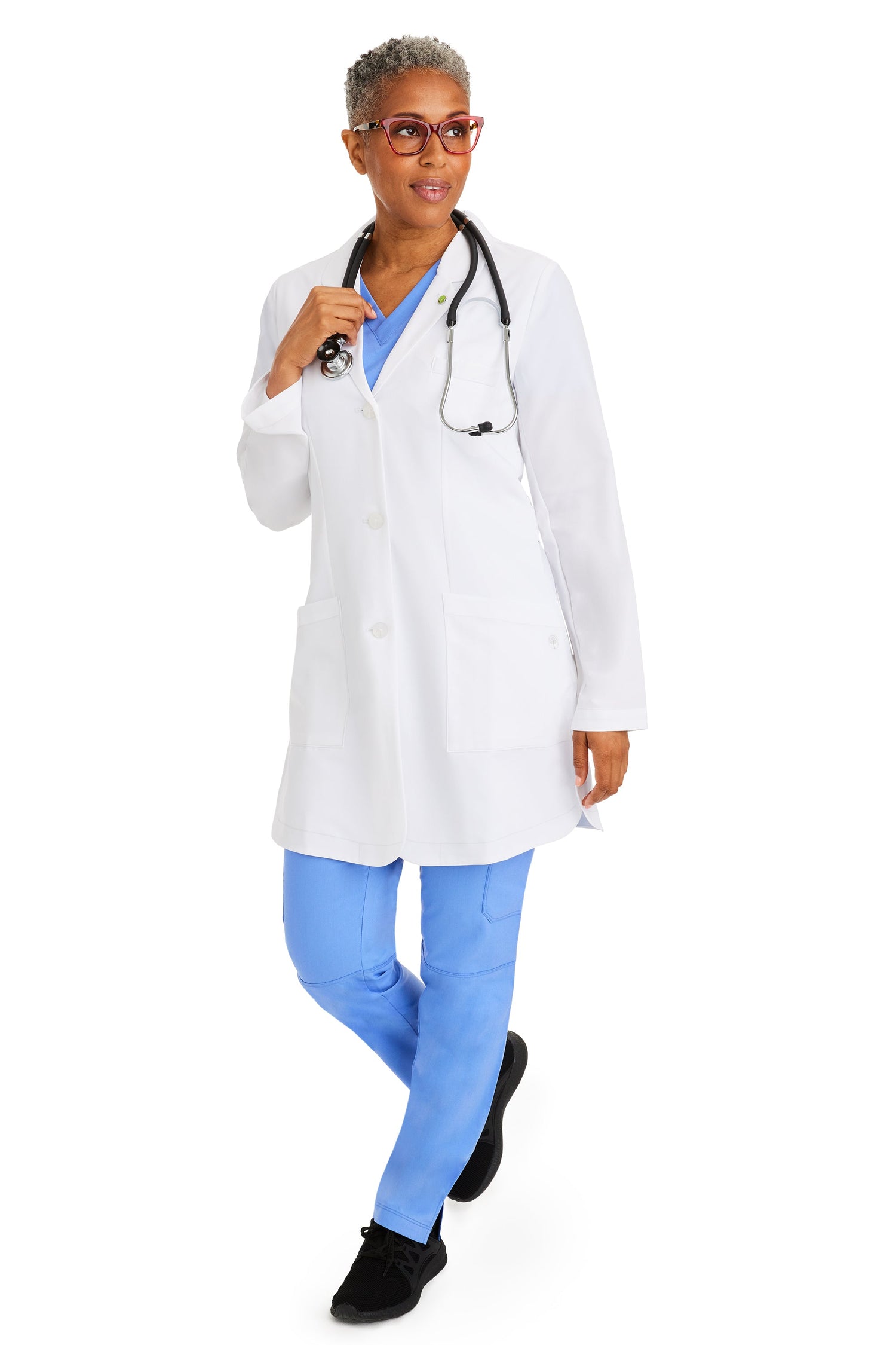 Female healthcare professional wearing Healing Hands Fiona women’s lab coat in white – Style 5101 by Omscrub GCC.